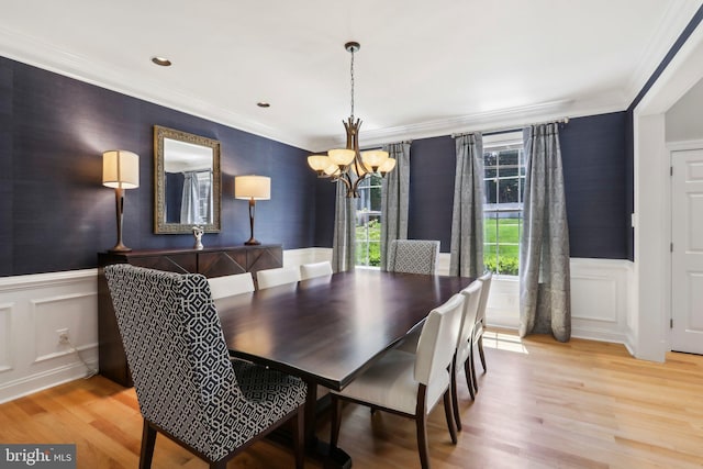 1311 Meadowbrook Ct, Jenkintown, PA 19046 - dining room featuring a chandelier, wainscoting, crown molding, light wood-type flooring, and a decorative wall
