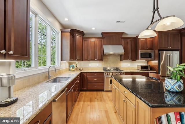 1311 Meadowbrook Ct, Jenkintown, PA 19046 - kitchen featuring under cabinet range hood, high quality appliances, a sink, light wood finished floors, and light stone counters