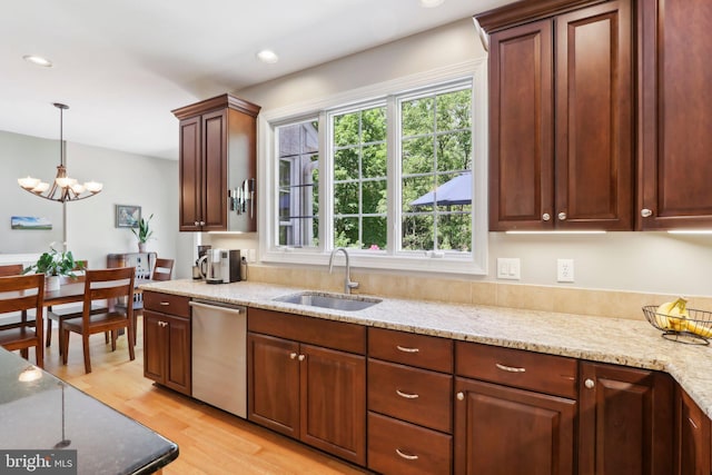 1311 Meadowbrook Ct, Jenkintown, PA 19046 - kitchen with stainless steel dishwasher, a sink, a chandelier, light wood-style floors, and light stone counters