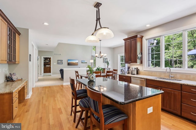 1311 Meadowbrook Ct, Jenkintown, PA 19046 - kitchen featuring a sink, stainless steel dishwasher, light wood-style floors, glass insert cabinets, and a kitchen island