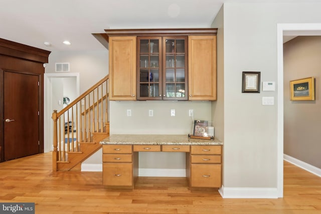1311 Meadowbrook Ct, Jenkintown, PA 19046 - kitchen featuring light wood-style floors, light stone counters, glass insert cabinets, baseboards, and recessed lighting