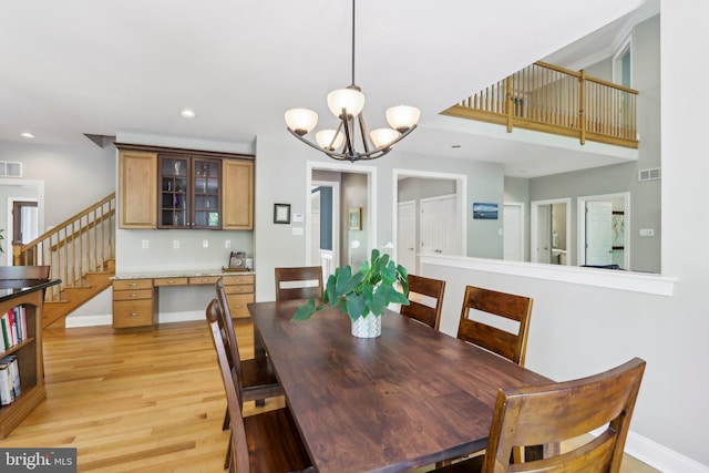 1311 Meadowbrook Ct, Jenkintown, PA 19046 - dining area featuring light wood-style floors, stairs, recessed lighting, a chandelier, and baseboards