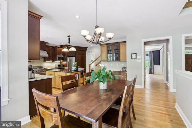 1311 Meadowbrook Ct, Jenkintown, PA 19046 - dining room featuring stairway, light wood-style floors, a chandelier, recessed lighting, and baseboards