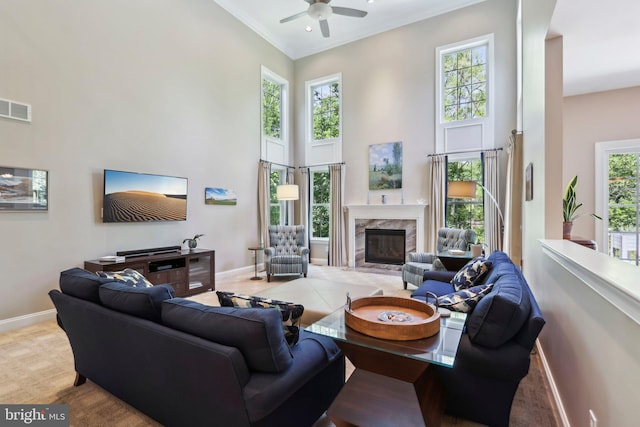 1311 Meadowbrook Ct, Jenkintown, PA 19046 - living room featuring baseboards, a towering ceiling, ceiling fan, a fireplace, and crown molding