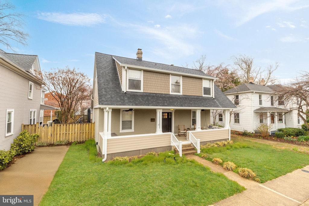 dutch colonial with a porch, a shingled roof, and a chimney