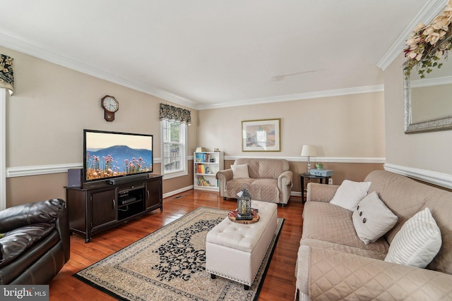 living room with ornamental molding, wood finished floors, and baseboards