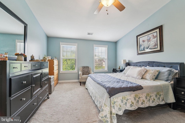 bedroom with light carpet, baseboards, and ceiling fan