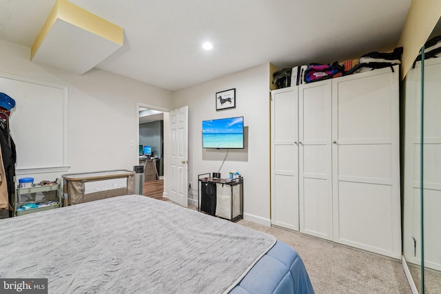 bedroom with light carpet, baseboards, and recessed lighting