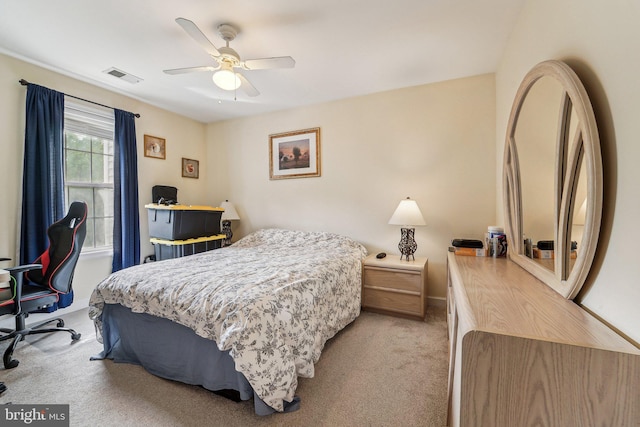 bedroom featuring light carpet, baseboards, and a ceiling fan