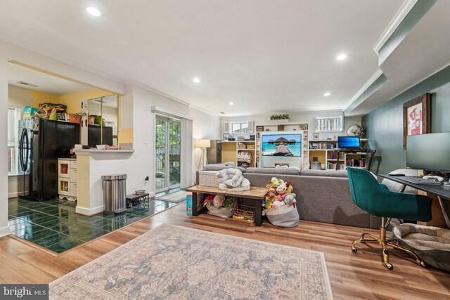 office space featuring ornamental molding, wood finished floors, and recessed lighting