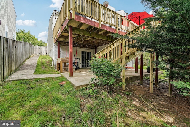 back of house with a deck, fence, a patio area, and stairway