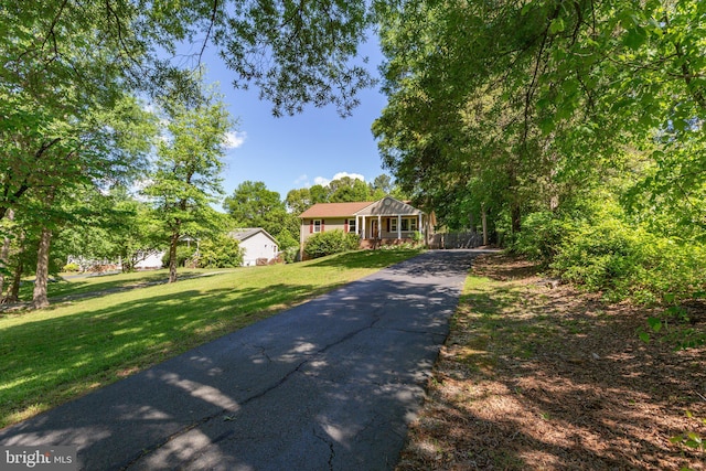 910 Ficklen Rd, Fredericksburg, VA 22405 - ranch-style home featuring asphalt driveway, a front lawn, and a porch