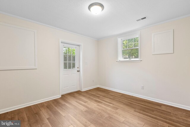 910 Ficklen Rd, Fredericksburg, VA 22405 - spare room with plenty of natural light, light wood-style flooring, baseboards, and ornamental molding