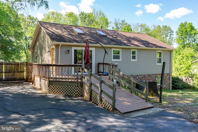 910 Ficklen Rd, Fredericksburg, VA 22405 - view of front of home with a deck, a shingled roof, and fence