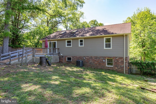 back of property with a wooden deck and central air condition unit