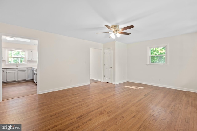 910 Ficklen Rd, Fredericksburg, VA 22405 - unfurnished room with plenty of natural light, ceiling fan, light wood-style floors, and baseboards