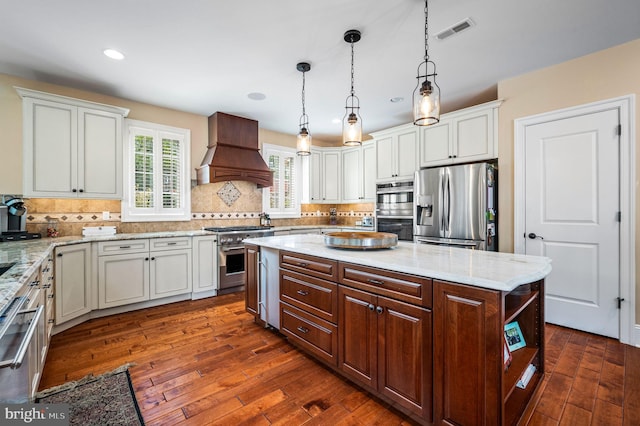 211 Dutton Mill Rd, West Chester, PA 19380 - kitchen featuring stainless steel appliances, premium range hood, dark wood-style floors, decorative backsplash, and recessed lighting
