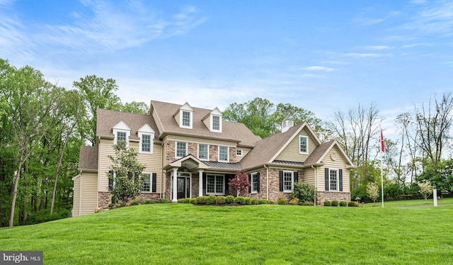 211 Dutton Mill Rd, West Chester, PA 19380 - shingle-style home with stone siding, a front lawn, and a standing seam roof