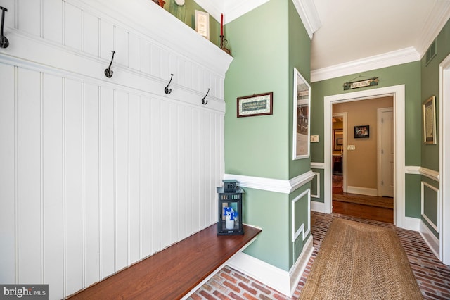 211 Dutton Mill Rd, West Chester, PA 19380 - mudroom featuring brick flooring, crown molding, and baseboards