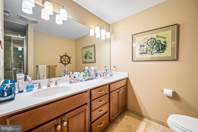 211 Dutton Mill Rd, West Chester, PA 19380 - full bathroom featuring toilet, double vanity, tile patterned floors, a shower with shower door, and baseboards