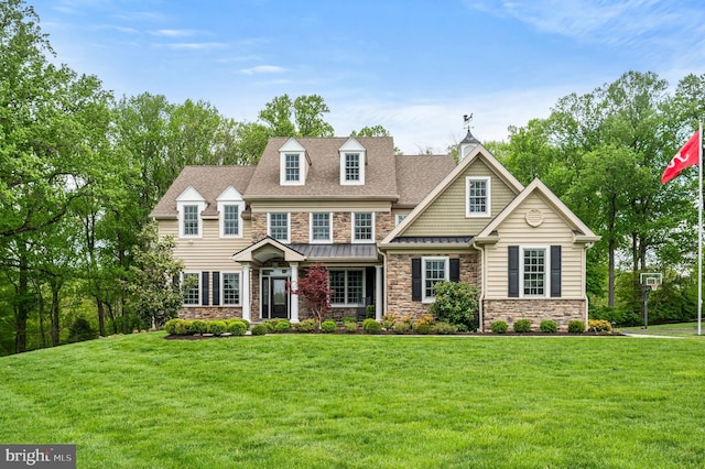 211 Dutton Mill Rd, West Chester, PA 19380 - view of front of house featuring stone siding, a front yard, a standing seam roof, and roof with shingles