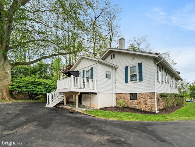 211 Dutton Mill Rd, West Chester, PA 19380 - view of home's exterior with stairway, a wooden deck, a chimney, and driveway