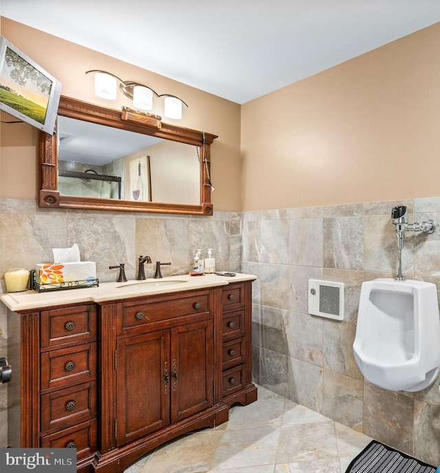 211 Dutton Mill Rd, West Chester, PA 19380 - bathroom featuring tile walls, vanity, and a wainscoted wall