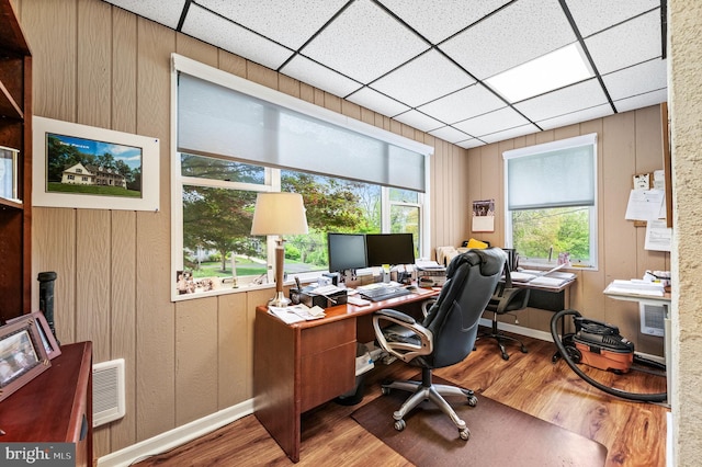 211 Dutton Mill Rd, West Chester, PA 19380 - home office featuring wood finished floors, baseboards, a paneled ceiling, and wood walls