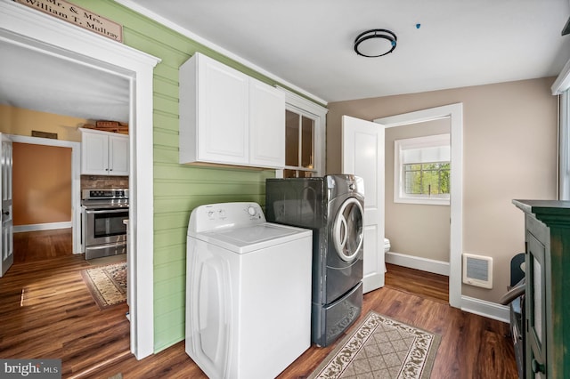 211 Dutton Mill Rd, West Chester, PA 19380 - laundry room with washing machine and dryer, baseboards, dark wood-style floors, and cabinet space