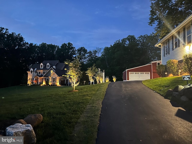 211 Dutton Mill Rd, West Chester, PA 19380 - view of front facade featuring driveway, a front yard, an outdoor structure, and an attached garage