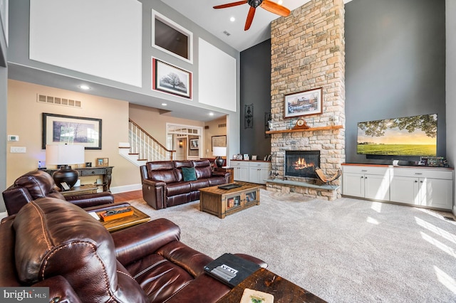 211 Dutton Mill Rd, West Chester, PA 19380 - living area with a towering ceiling, ceiling fan, a fireplace, stairway, and carpet