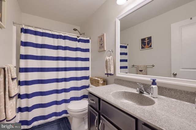 bathroom with vanity, toilet, and a shower with curtain