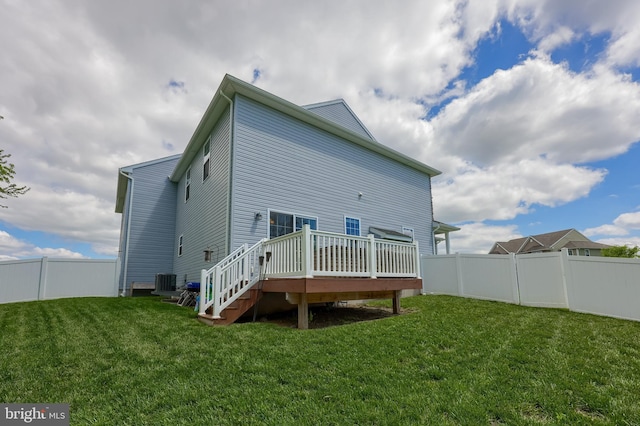 rear view of property with a wooden deck and cooling unit