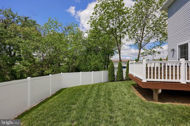 view of yard with a deck