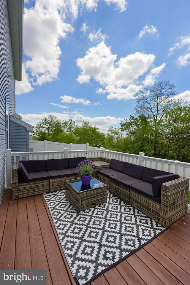 wooden deck with an outdoor hangout area