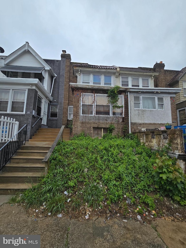 back of house with brick siding