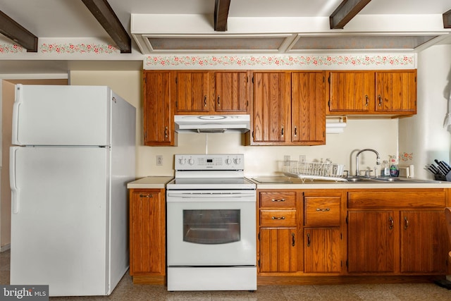 kitchen featuring white appliances, under cabinet range hood, beamed ceiling, brown cabinets, and light countertops