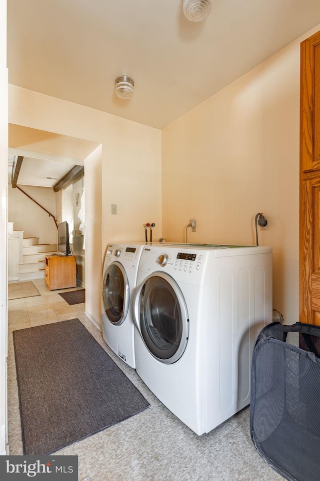 laundry area featuring separate washer and dryer and tile patterned floors