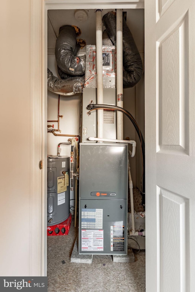 utility room with water heater