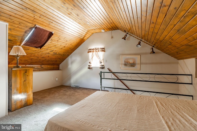 unfurnished bedroom with carpet flooring, lofted ceiling, and wooden ceiling