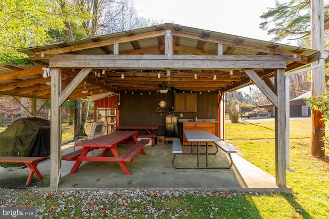 view of patio / terrace with ceiling fan and grilling area