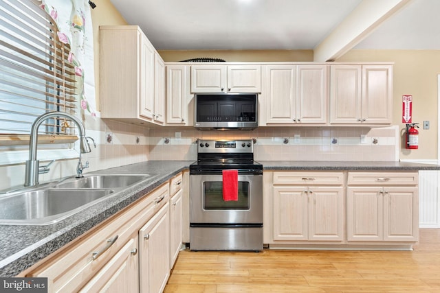 90 Echohill Ln, Willingboro, NJ 08046 - kitchen featuring stainless steel appliances, a sink, decorative backsplash, and dark countertops