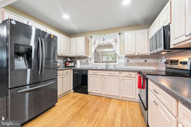 90 Echohill Ln, Willingboro, NJ 08046 - kitchen with appliances with stainless steel finishes, a sink, light wood finished floors, dark countertops, and recessed lighting