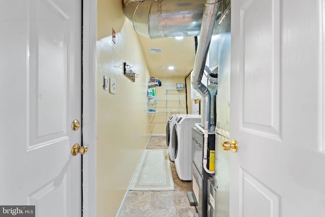 90 Echohill Ln, Willingboro, NJ 08046 - clothes washing area with washing machine and clothes dryer and light stone finish flooring