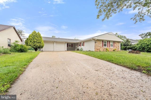 90 Echohill Ln, Willingboro, NJ 08046 - single story home with an attached garage, driveway, stone siding, and a front lawn