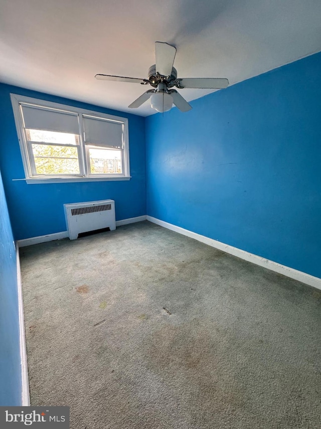 2939 Tyson Ave, Philadelphia, PA 19149 - spare room with radiator heating unit, baseboards, carpet, and ceiling fan