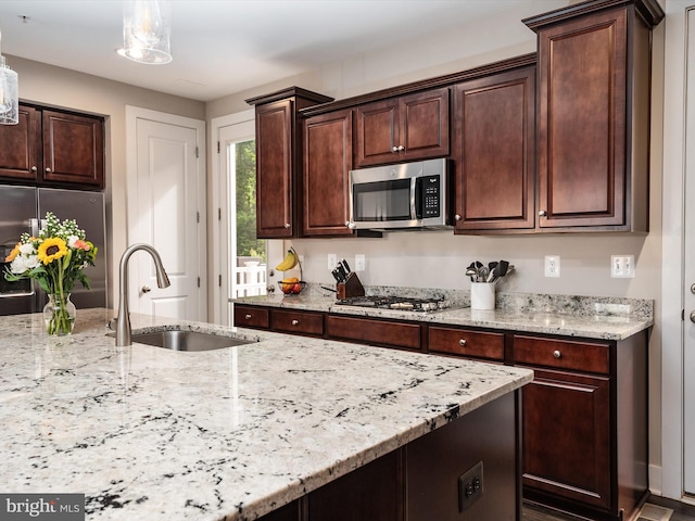 1205 Hickory Hill Cir, Arnold, MD 21012 - kitchen with stainless steel appliances, a sink, light stone countertops, and dark brown cabinetry
