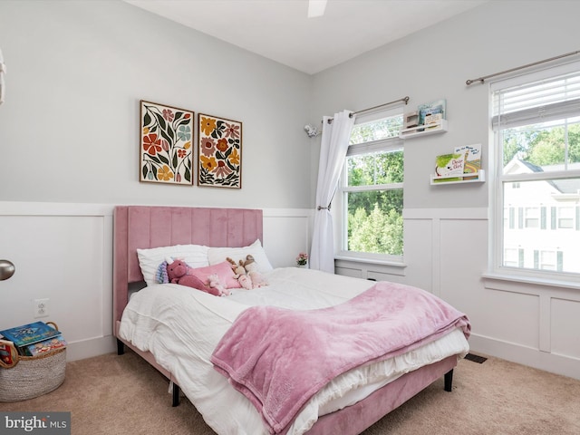 1205 Hickory Hill Cir, Arnold, MD 21012 - bedroom with carpet flooring, a wainscoted wall, a decorative wall, and a ceiling fan