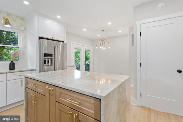 3 Knox Pl, Silver Spring, MD 20901 - kitchen with high end refrigerator, a kitchen island, light stone countertops, white cabinets, and recessed lighting