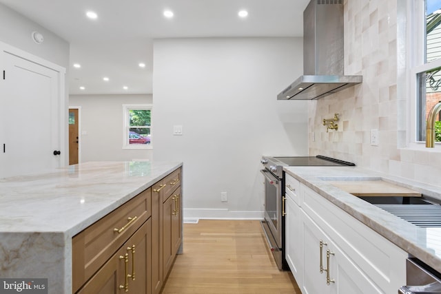 3 Knox Pl, Silver Spring, MD 20901 - kitchen with wall chimney exhaust hood, electric stove, light wood-style flooring, decorative backsplash, and recessed lighting
